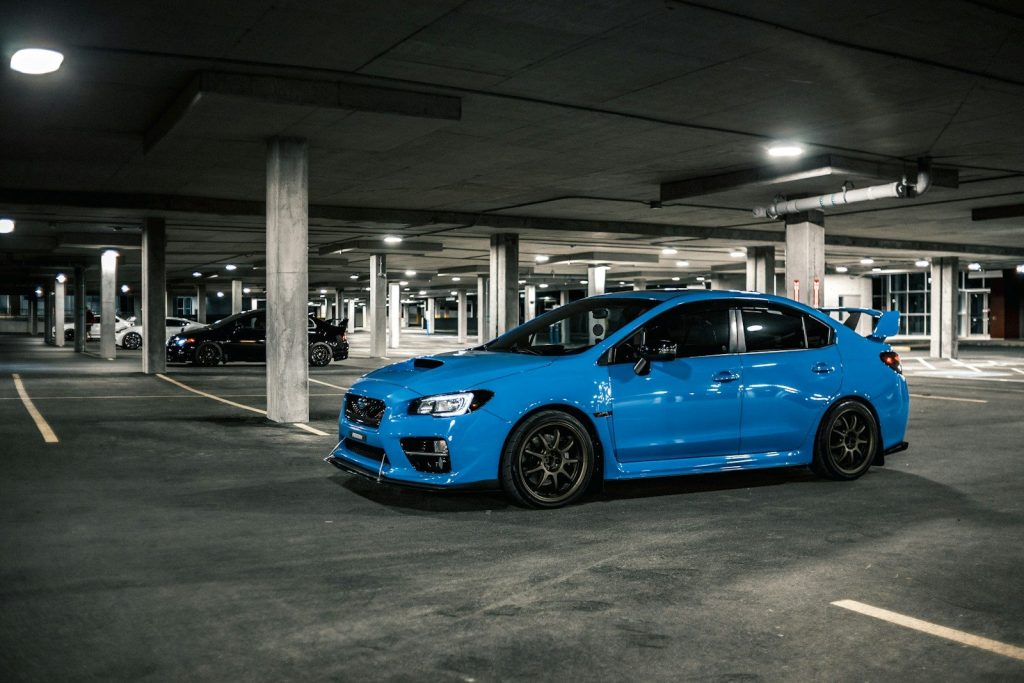 blue bmw m 3 parked on parking lot