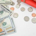 silver round coins and 100 us dollar bill