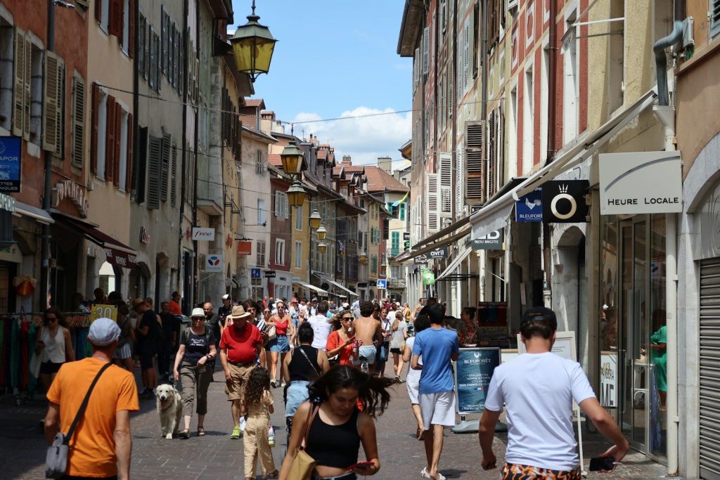 a group of people walking down a street