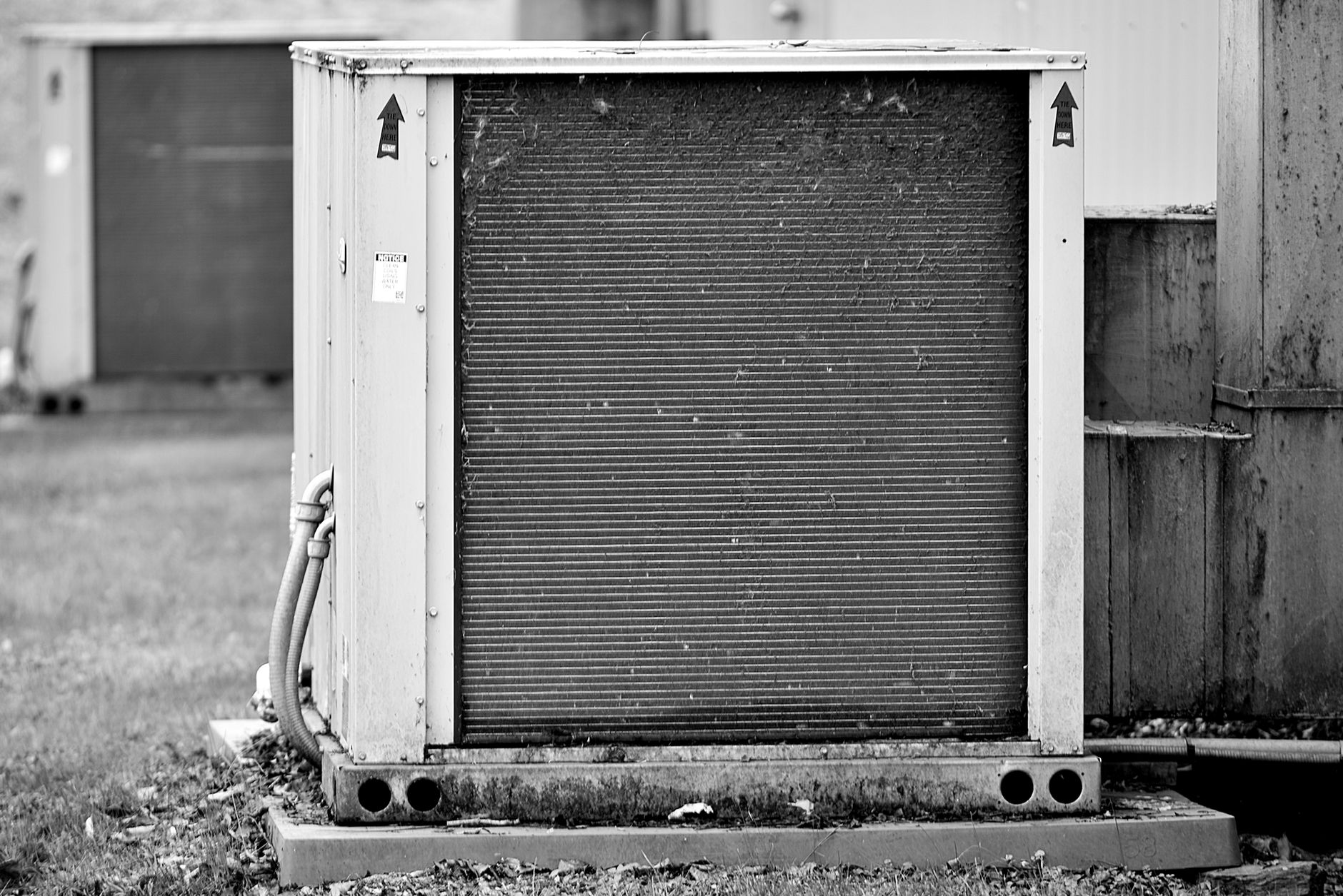 Close up of an industrial HVAC unit outdoors, showcasing its metal texture.