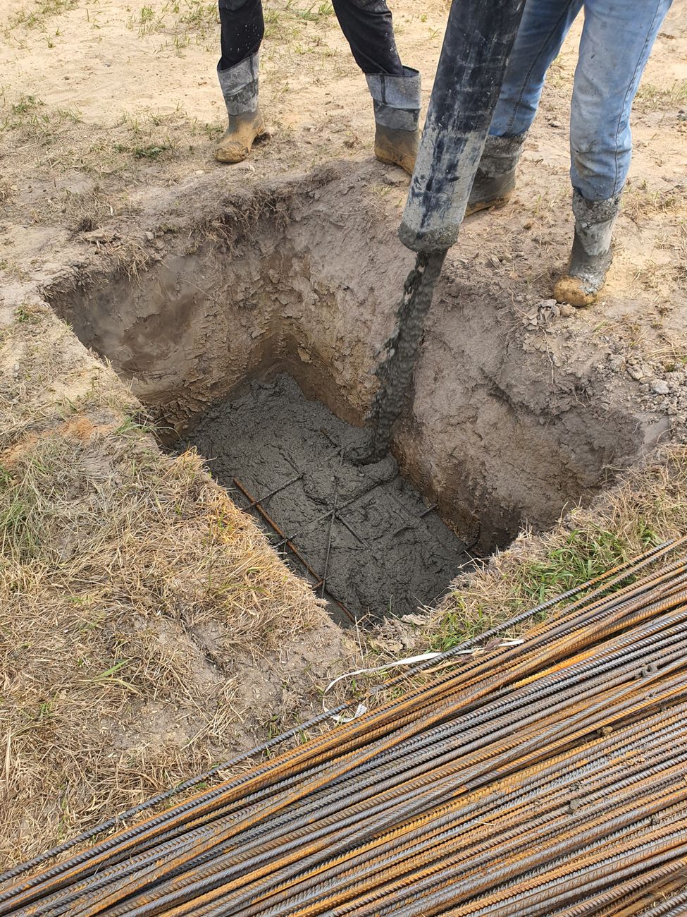 A detailed view of concrete pouring at a construction site in Miedniewice Topola, Poland.