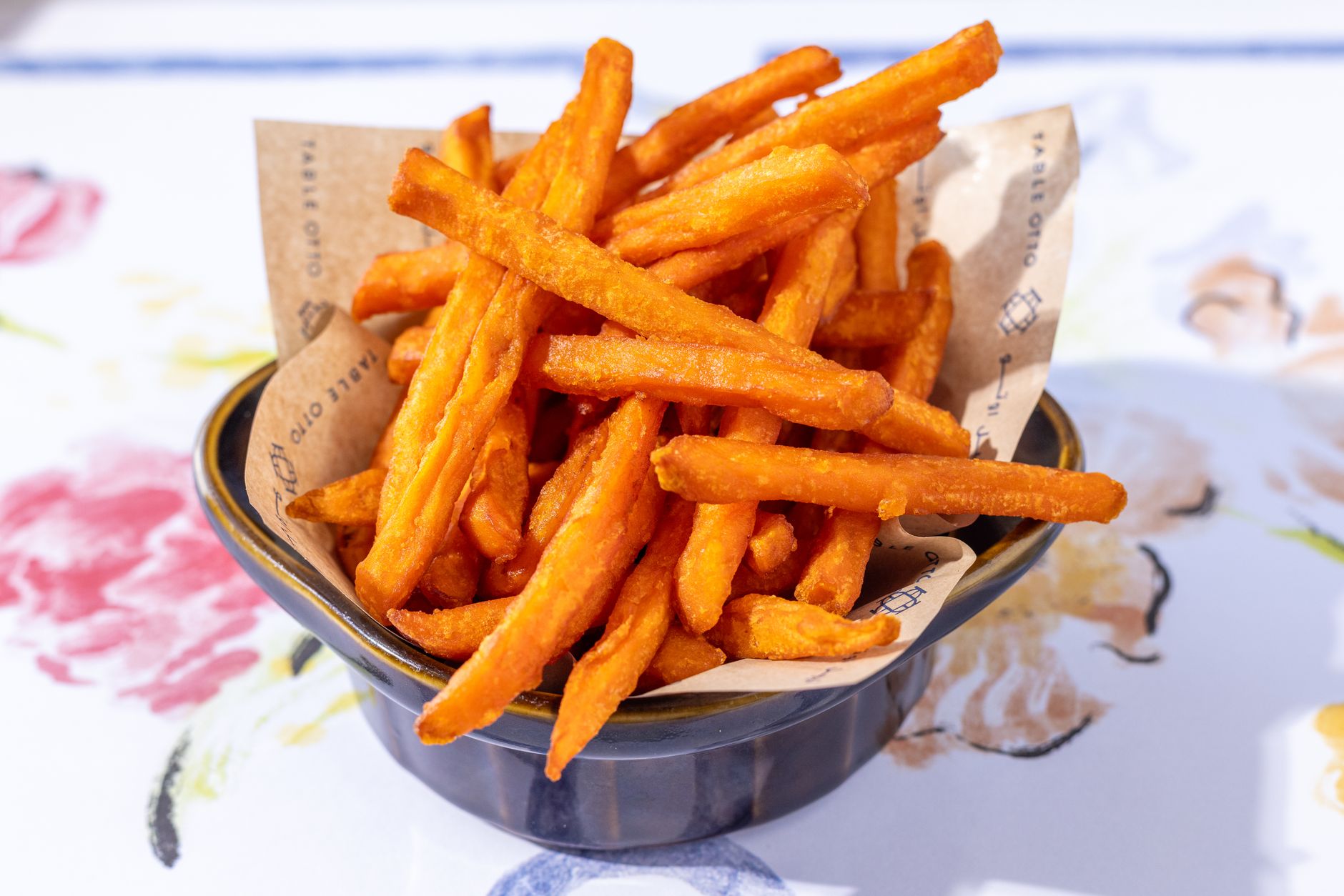 Crispy sweet potato fries served in a bowl, perfect snack or side dish.