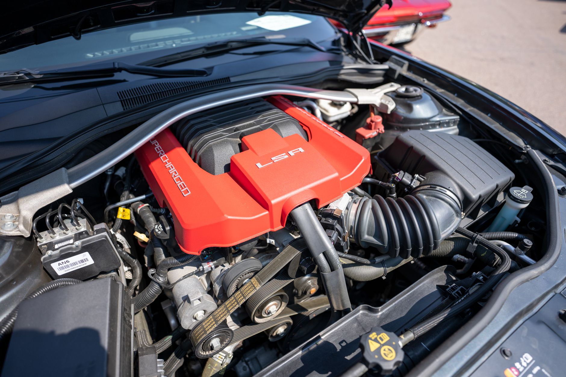 Detailed view of a supercharged LSA engine in a car.