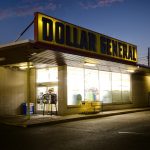 A dollar general store lit up at night