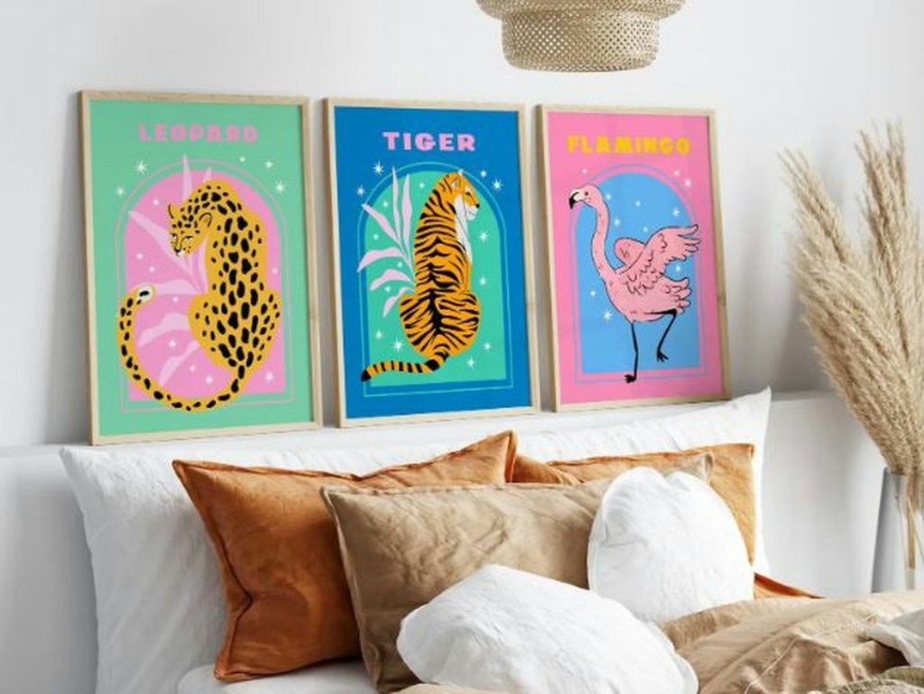 Animal-themed art prints hang over a stylish bed.