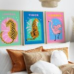 Animal-themed art prints hang over a stylish bed.