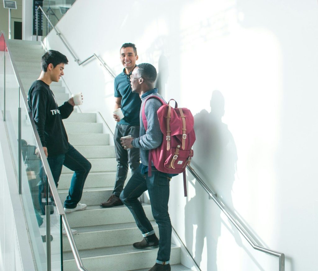 a group of people walking down a flight of stairs