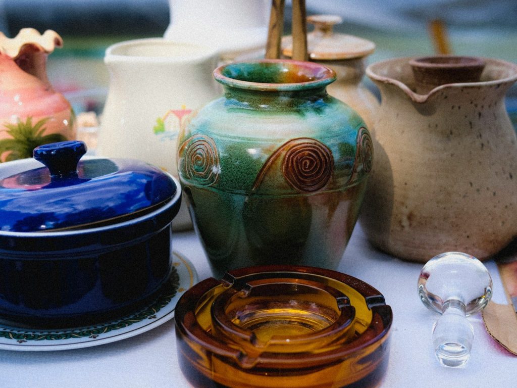 a group of vases sit on a table