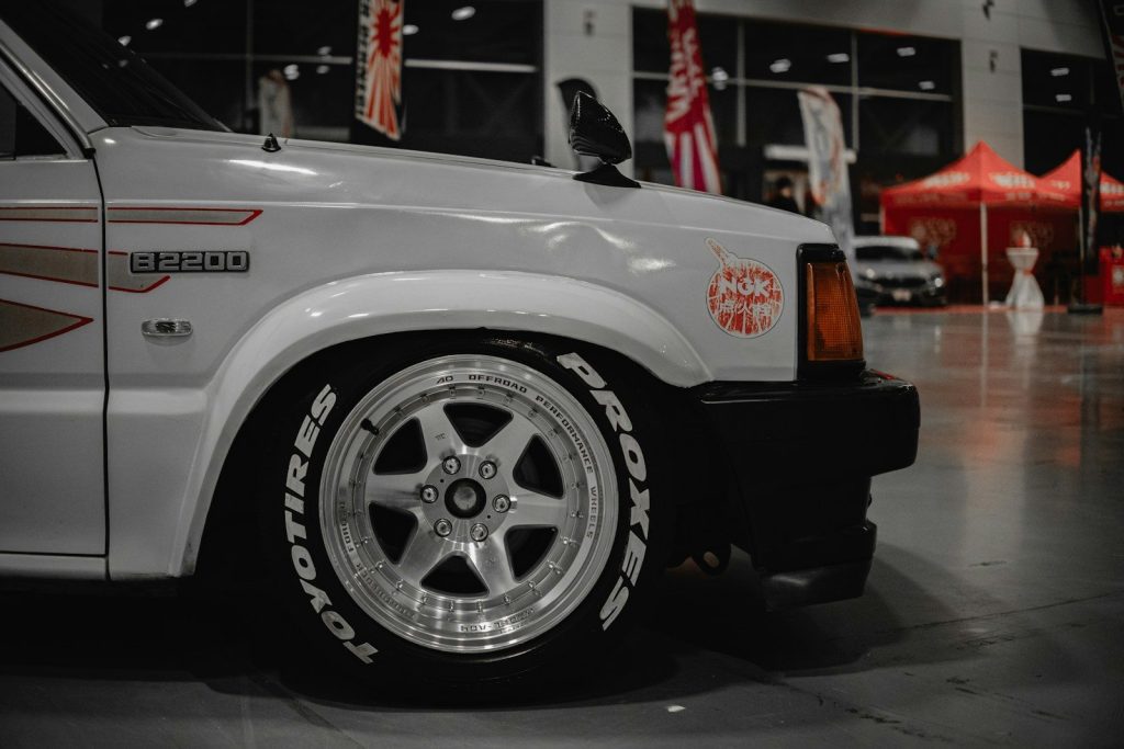A white truck parked inside of a garage