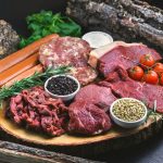 raw meat on white ceramic plate
