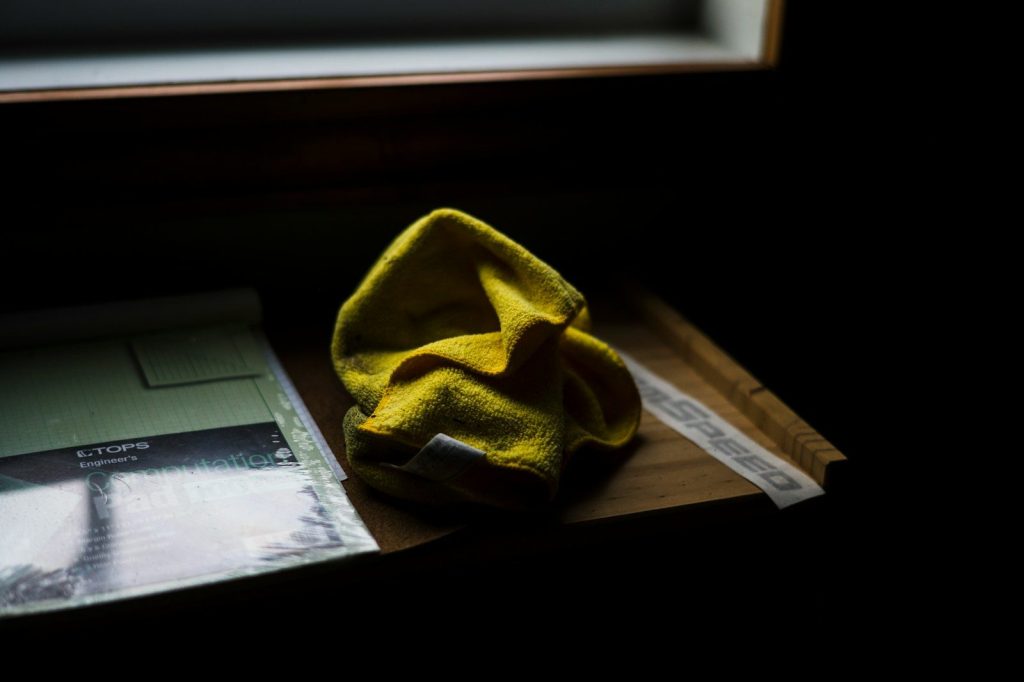 a yellow cloth sitting on top of a wooden table
