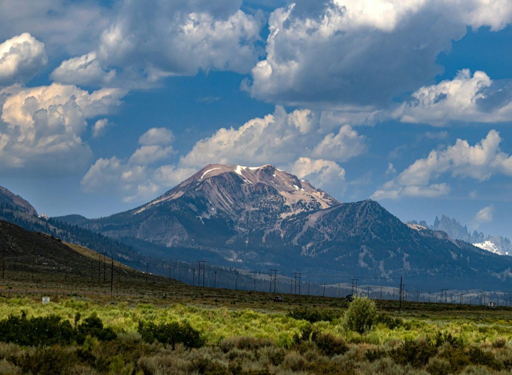 a mountain with a fence in front of it