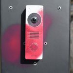 Intercom device with red spray paint markings