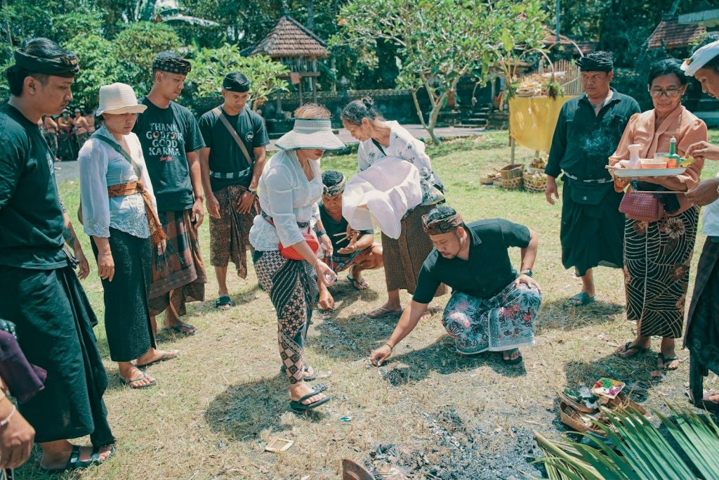 People gathered outdoors for a traditional ceremony.