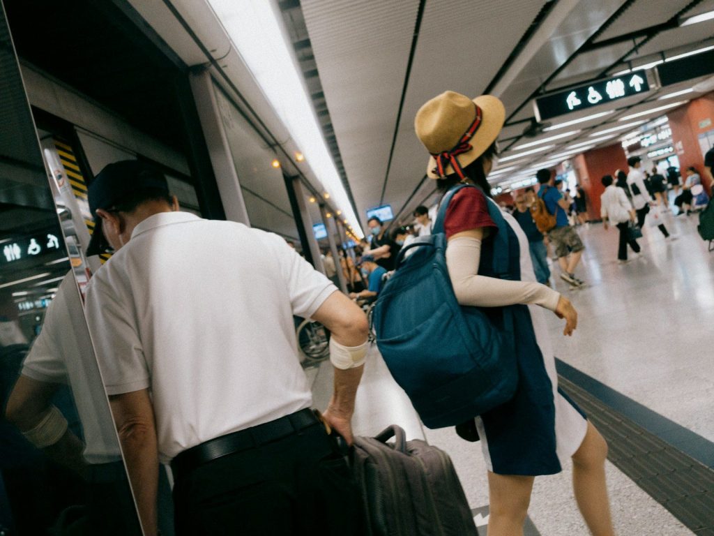 a man and a woman with luggage at an airport