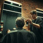 a man getting his hair cut in front of a mirror