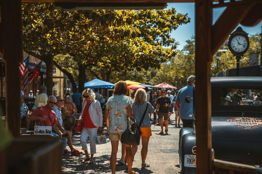 people walking on a sidewalk