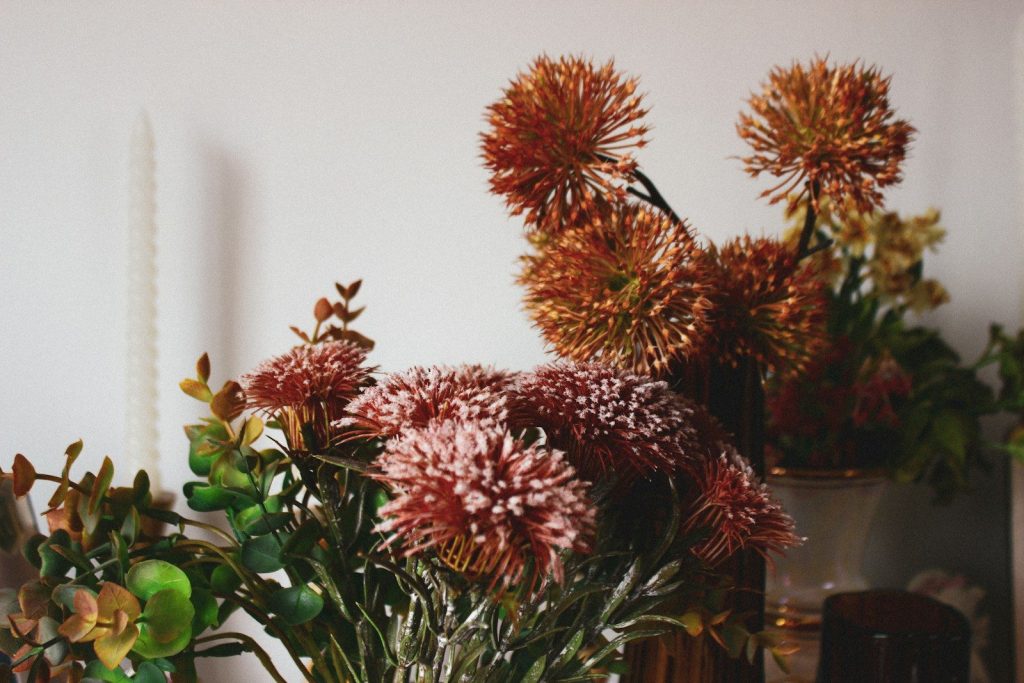 Close-up of dried floral arrangement with warm tones