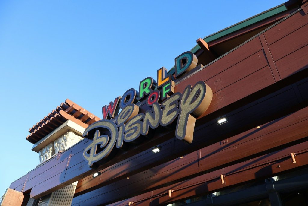 World of disney store sign against blue sky