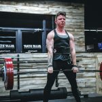 man lifting barbell