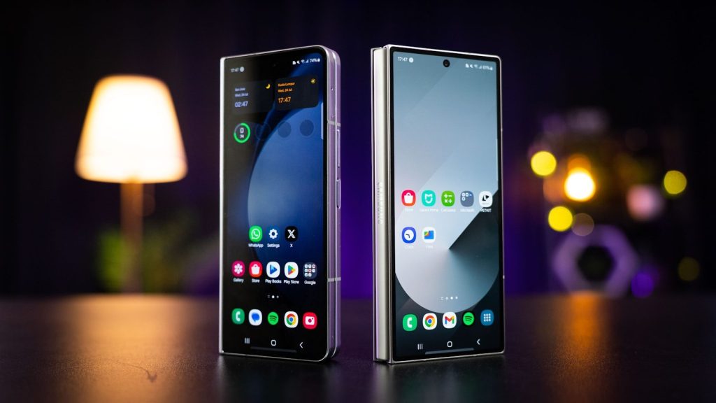 Two cell phones sitting next to each other on a table