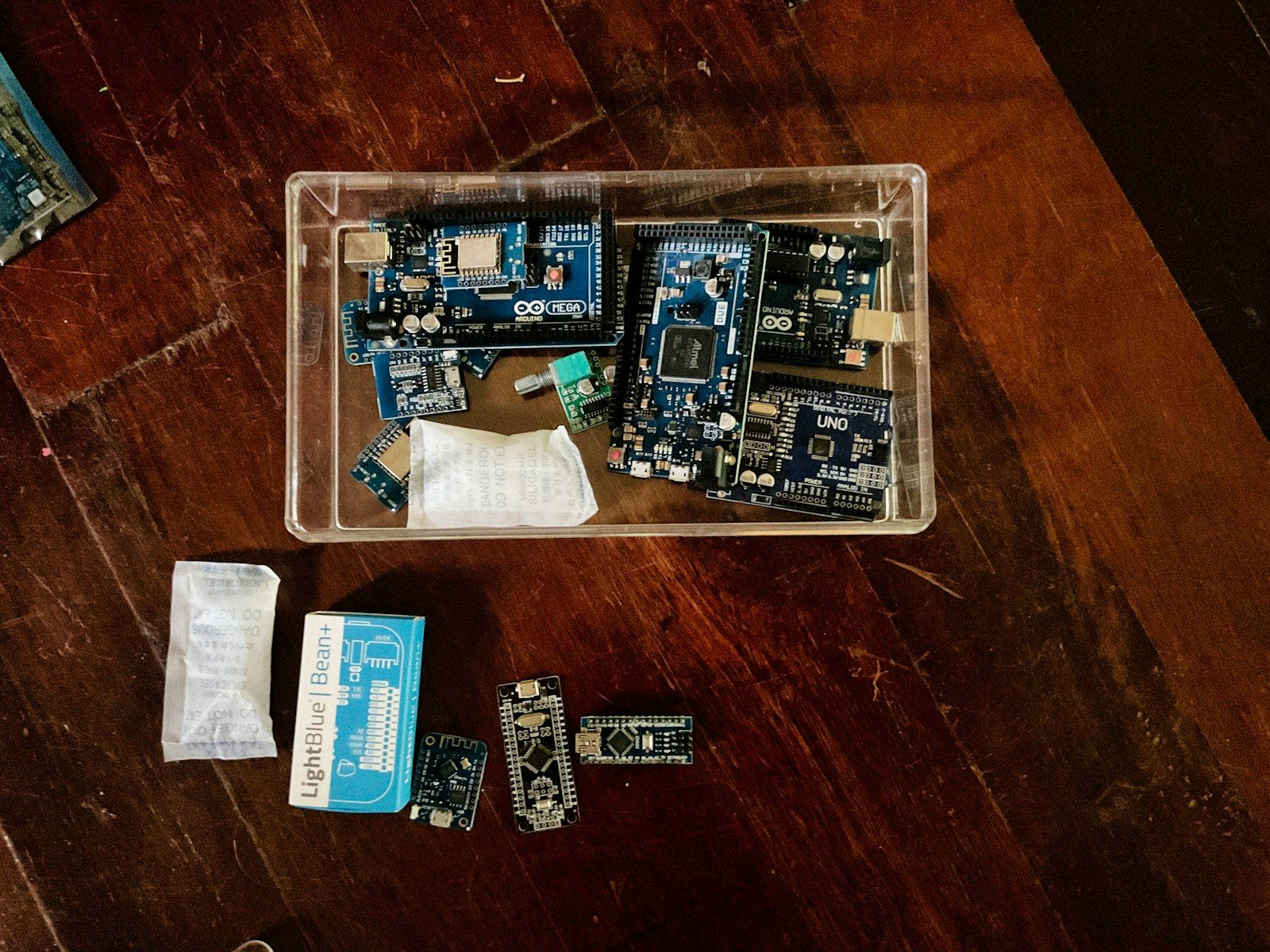Electronic circuit boards are organized in a container.