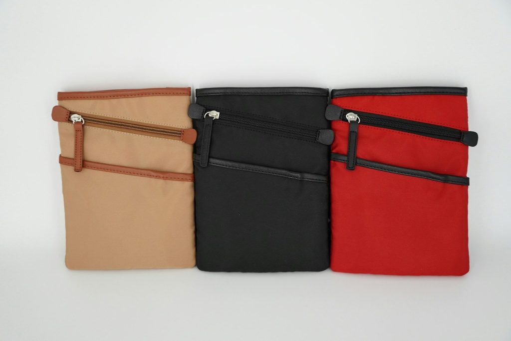 Three colorful purses are displayed side-by-side.