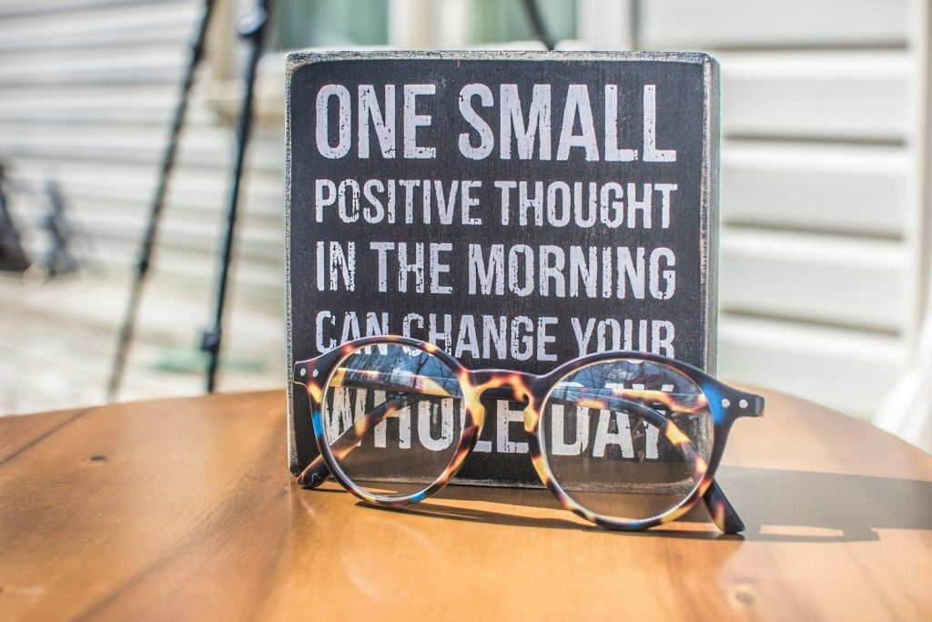 a sign with glasses on it