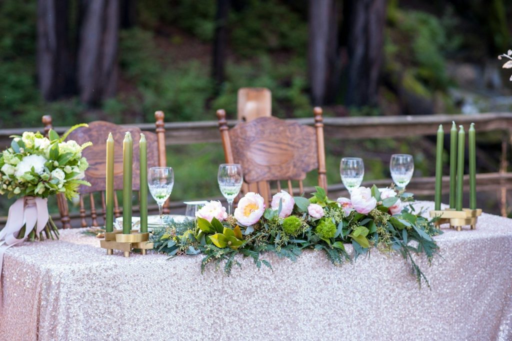 Wedding table setting with floral arrangements and candles