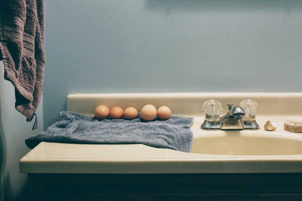 a towel and some eggs on a counter