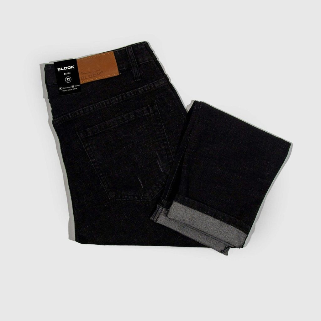 a pair of black jeans on a white background