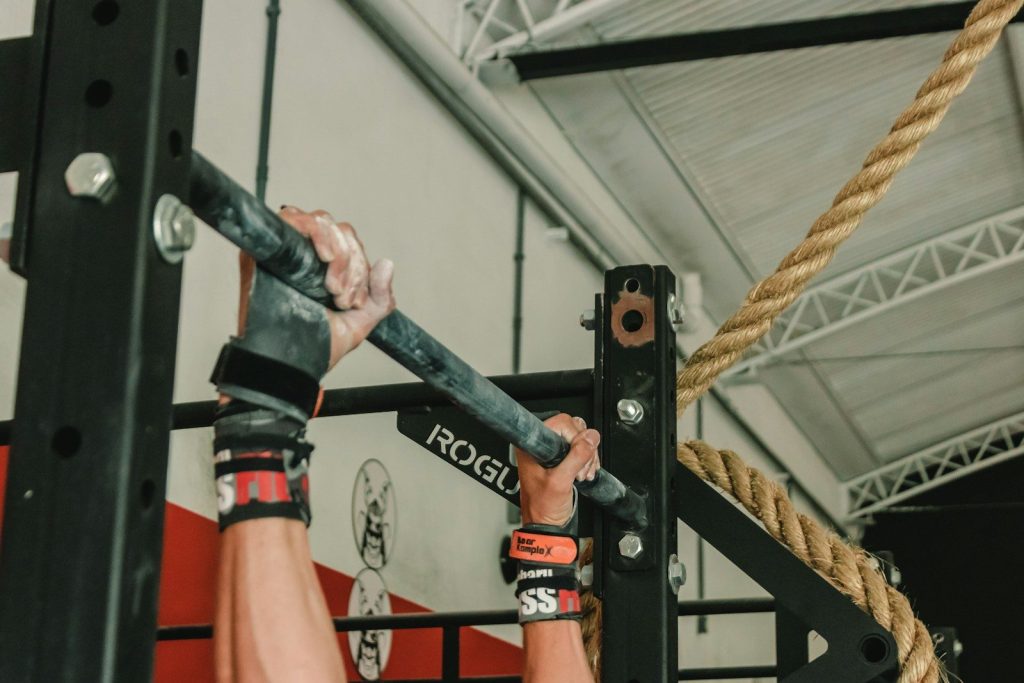person holding barbell