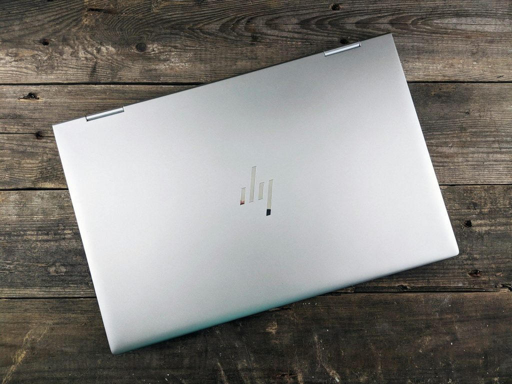 a white rectangular device on a wooden surface