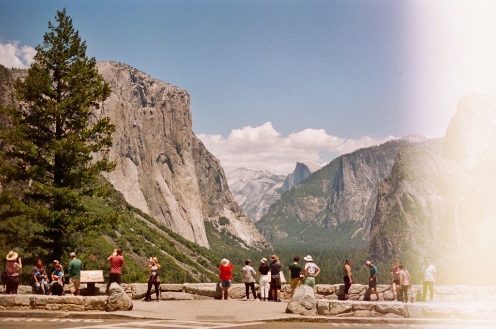 a group of people standing on top of a mountain