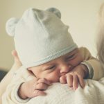 woman carrying baby