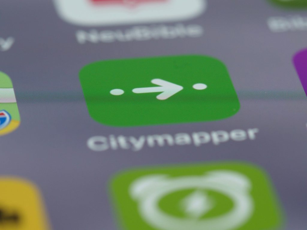 a close up of a cell phone with many different app icons
