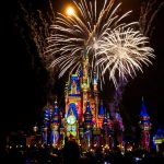 a castle is lit up with fireworks at night