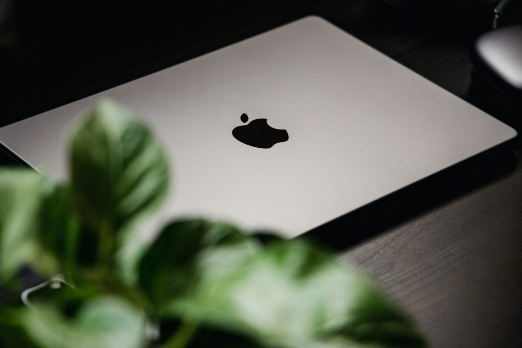 a black apple on a white tablet