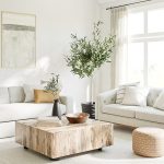 a living room filled with furniture and a large window