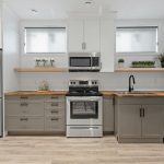 a kitchen with white cabinets