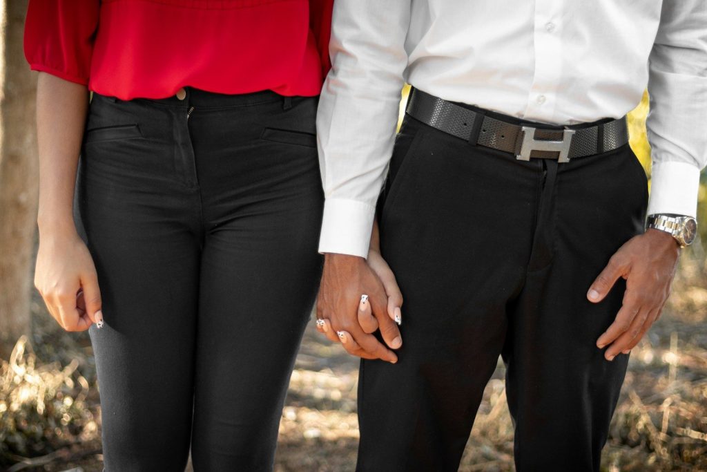 person in red shirt and black pants