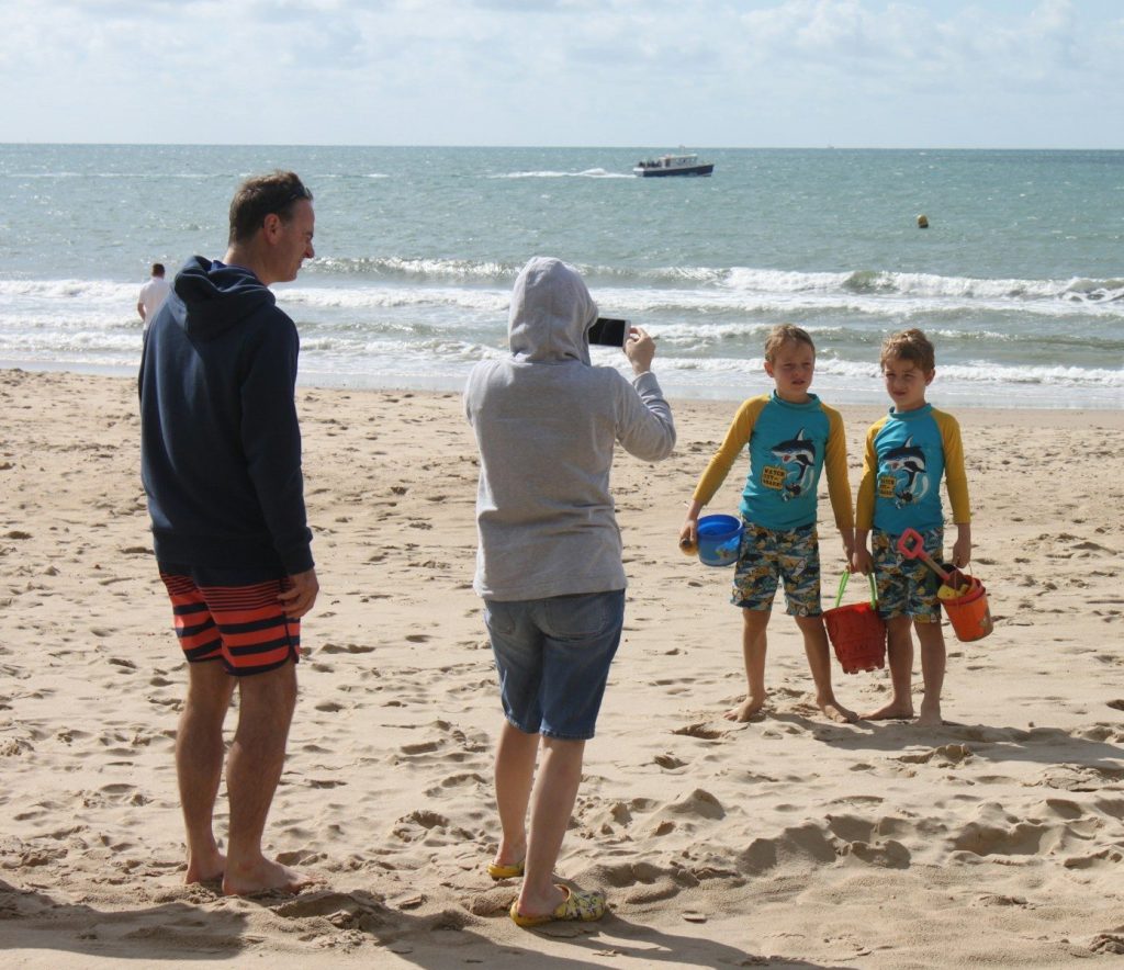 people walking on beach during daytime